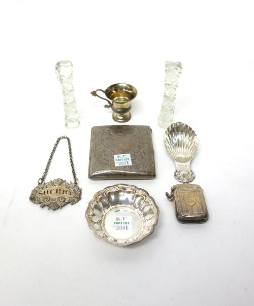 Silver, comprising; a rectangular vesta case, the front folding down to reveal a locket compartment, Birmingham 1913, a rectangular cigarette case wit