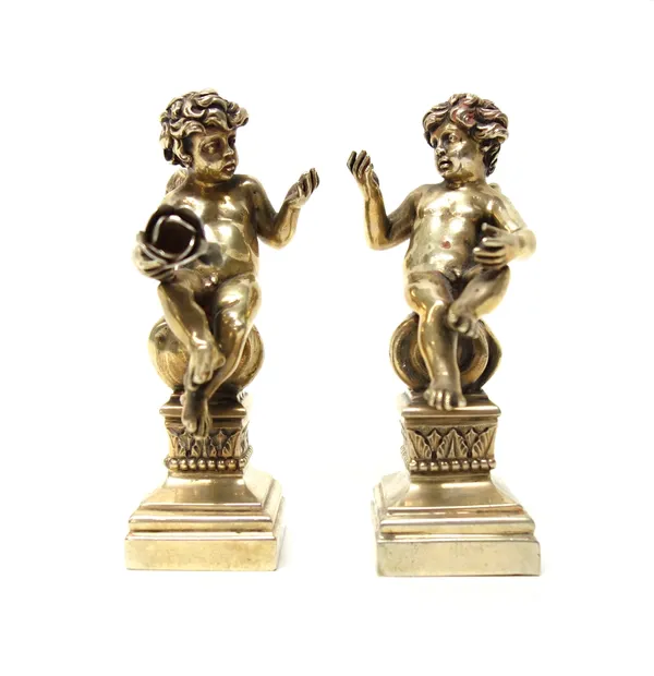 A pair of European models of seated cherubs, each raised on a square base, detailed 800, probably Italian, 10.5cm high (one flower lacking).