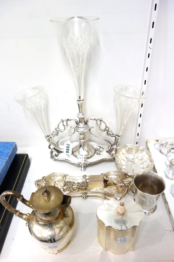 Plated wares, comprising; a table centrepiece stand, fitted with three faceted glass trumpet shaped vases, a pair of candle snuffers, with a snuffers