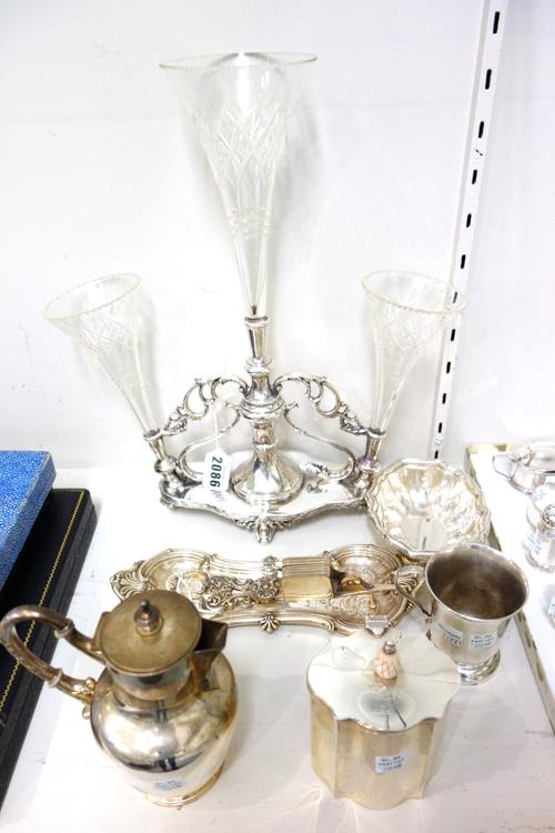 Plated wares, comprising; a table centrepiece stand, fitted with three faceted glass trumpet shaped vases, a pair of candle snuffers, with a snuffers