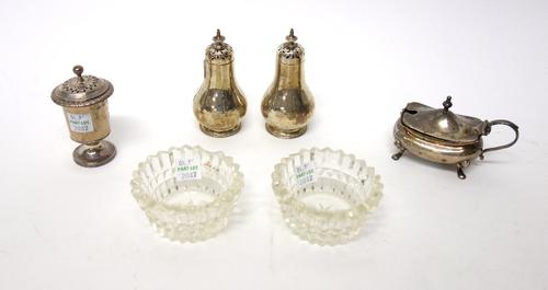 Silver, comprising; a pair of Victorian baluster shaped pepperettes, London 1868, another pepperette decorated with a gadrooned rim, London 1866 and a