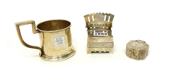 A Russian salt chair, with pierced and engraved decoration, Moscow 1865, a Russian tea glass holder, with engraved decoration, Moscow 1884 and an octa