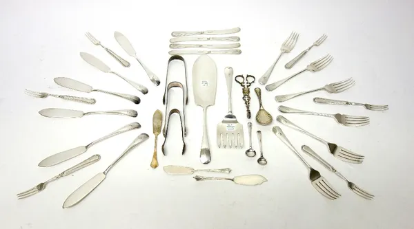 A pair of silver scissor action sugar nips, three pairs of silver sugar tongs, various dates, three silver butter knives and a silver salt spoon, comb