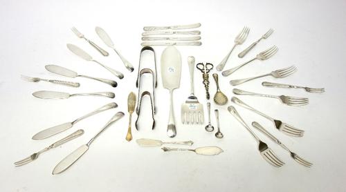 A pair of silver scissor action sugar nips, three pairs of silver sugar tongs, various dates, three silver butter knives and a silver salt spoon, comb