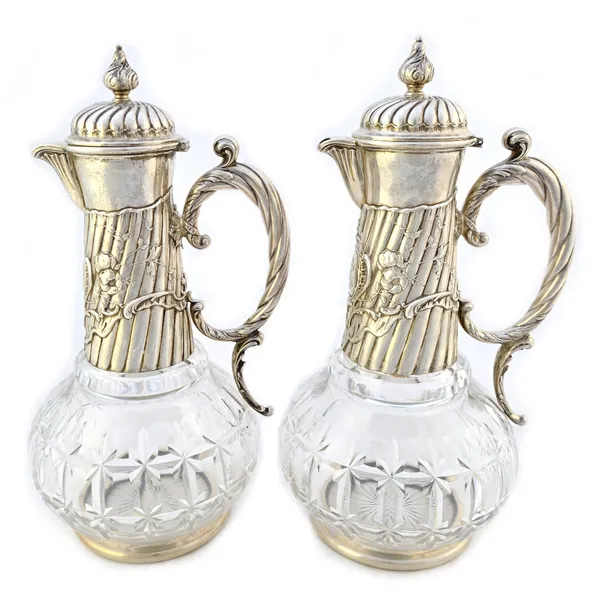 A pair of German cut glass claret jugs, with incised maker's mark A.P. circa 1895 and further stamped with an Austrian import mark for 1891-1901, each