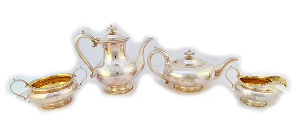 A William IV silver four piece tea set, comprising; a teapot, a hot water jug, a twin handled sugar bowl and a milk jug, each piece of squat circular