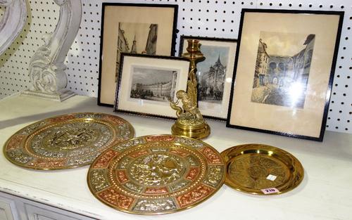 A pair of Eastern inlaid brass dishes, together with a circular brass plate and a candlestick formed as a bird fighting a serpent, together with a sma