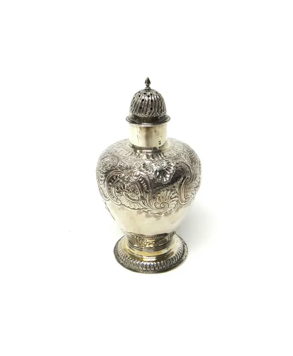 A European silver sugar caster, with scroll and foliate embossed decoration and on a ridged circular foot, detailed 930, import mark London 1895, weig