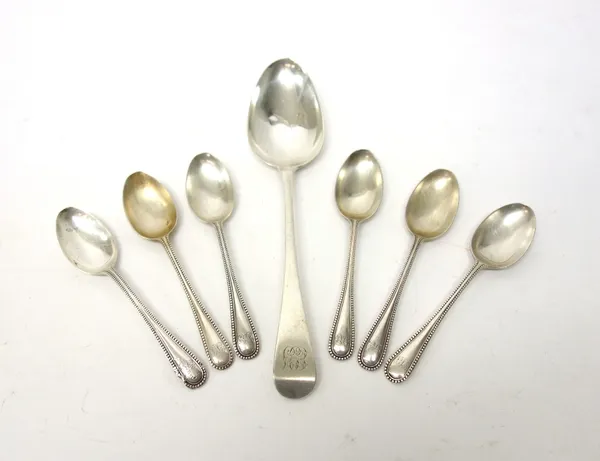 Silver flatware, comprising; a George III Old English pattern tablespoon, London 1799 and six bead edged Old English pattern teaspoons, with differing