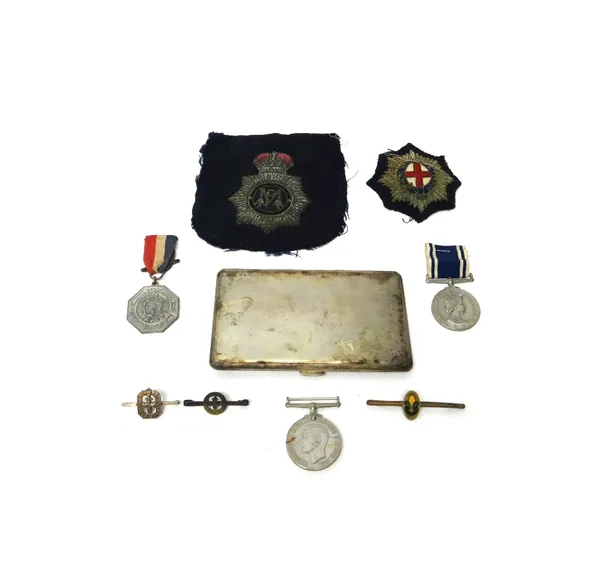 The Medal for Exemplary Police Service Elizabeth II issue to CONST.STANLEY GL.CLARKE, The 1939-45 Defence Medal, a silver rectangular cigarette case,