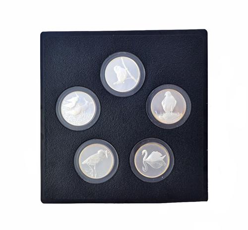 A set of thirty-five silver proof medallions, commemorating Peter Scott's British Birds, by John Pinches, with a wooden case and leaflets giving detai