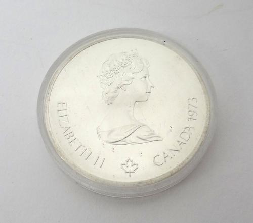 Twenty Canadian silver ten dollar coins, commemorating The Montreal Olympics 1976, encased in plastic capsules.