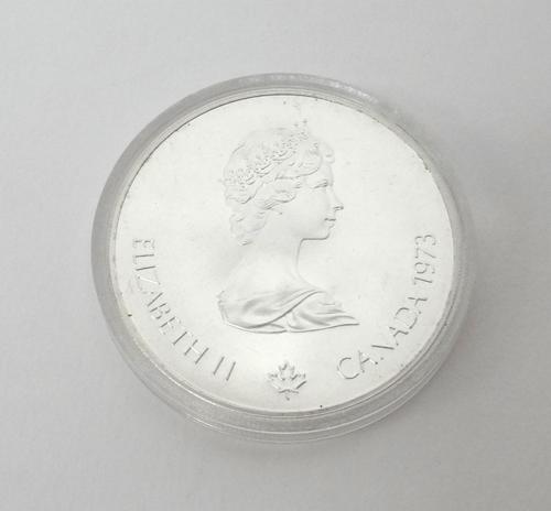 Twenty Canadian silver five dollar coins, commemorating The Montreal Olympics 1976, encased in plastic capsules.