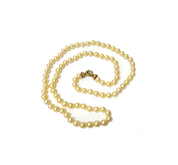 A single row necklace of largely uniform cultured pearls, the diameters approximately 9.0-9.5 mm, on a gold and diamond set clasp, mounted with circul