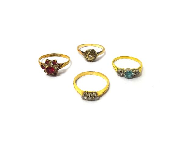 A gold and diamond set three stone ring, an 18ct gold, blue zircon and diamond set three stone ring, a 9ct gold and diamond set cluster ring and a 9ct