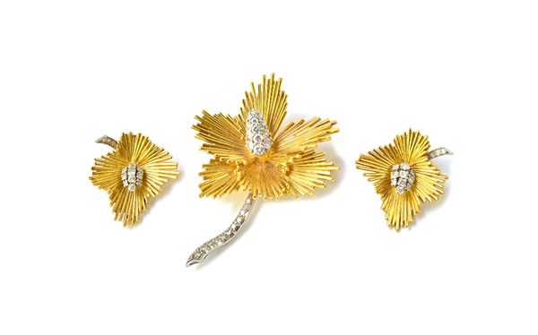 A gold and diamond set brooch, designed as a flower spray, the flowerhead centre and the stem mounted with circular cut diamonds and a pair of gold an