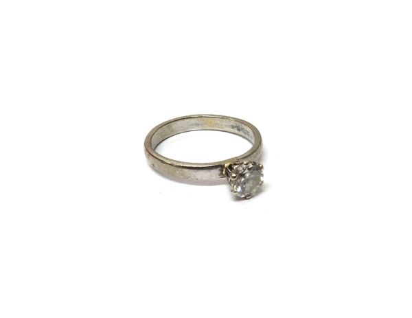 A diamond set single stone ring, claw set with a circular cut diamond, ring size N, with a box.