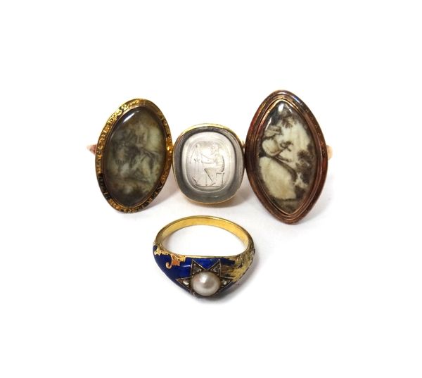 A gold mourning ring, glazed with an urn to the centre, detailed R.C and with traces of black enamel and the date 1781 to the border, a navette shaped