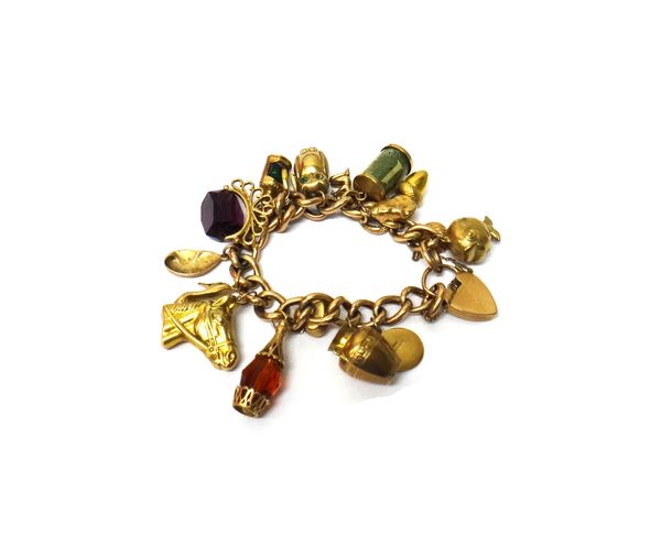 A gold, decorated and plain curb link charm bracelet, on a gold decorated heart shaped padlock clasp, fitted with a variety of mostly 9ct gold pendant