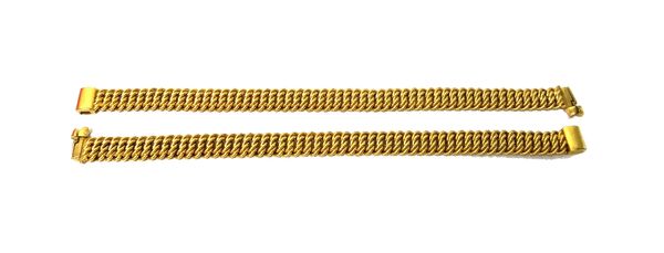 A pair of gold bracelets, each in a serpentine multiple scroll link design, on a sliding clasp, detailed 14 K, length 18cm, combined weight 81 gms.