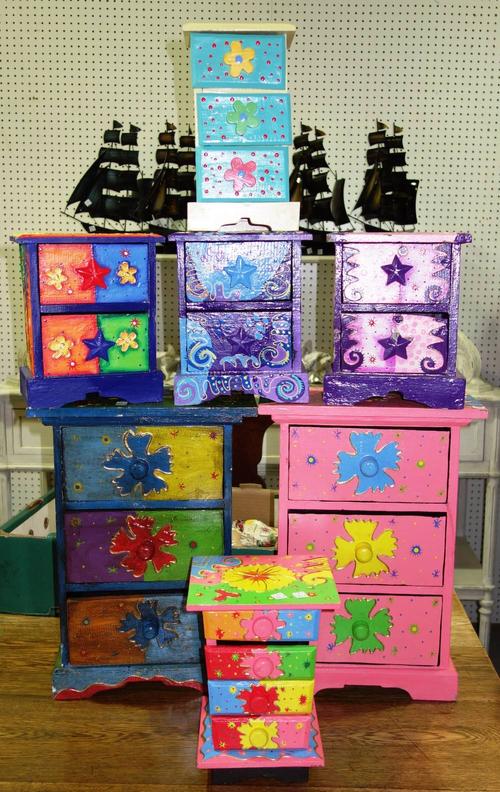 A blue painted lift top storage box and seven small painted chest of drawers. (8)