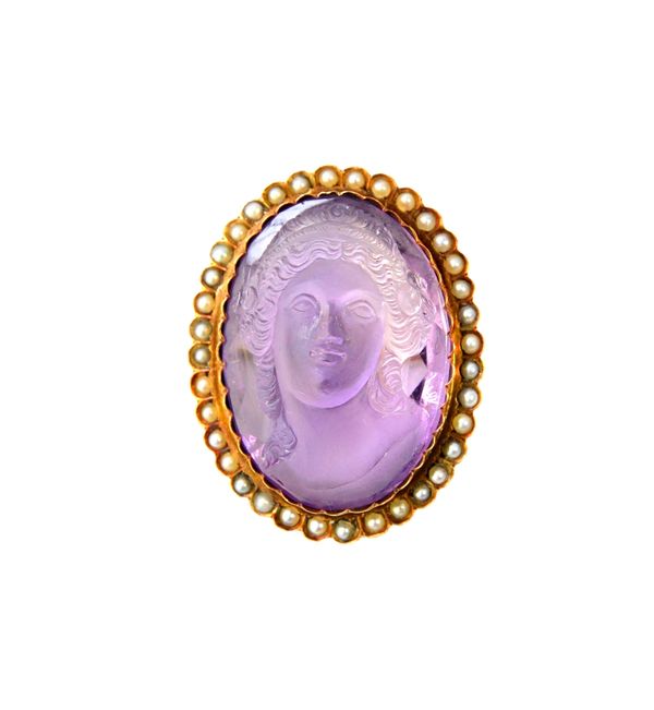 A gold, carved amethyst cameo and seed pearl set brooch, the oval carved amethyst cameo designed as the portrait of a lady, within a surround of half