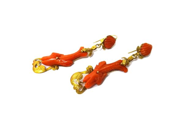 A pair of gold and carved coral pendant earrings, each drop carved as a stylized classical dolphin and with a scallop shell shaped surmount, the tops