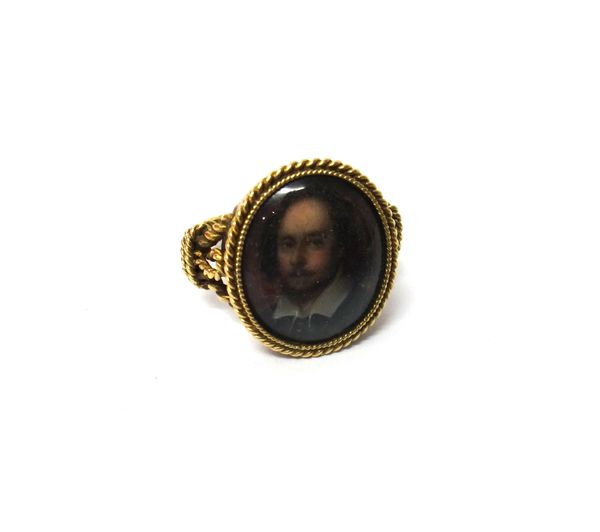 A gold and enamelled ring, mounted with the oval enamelled portrait of William Shakespeare, detailed at the back Shakespeare, from the Chandos Picture