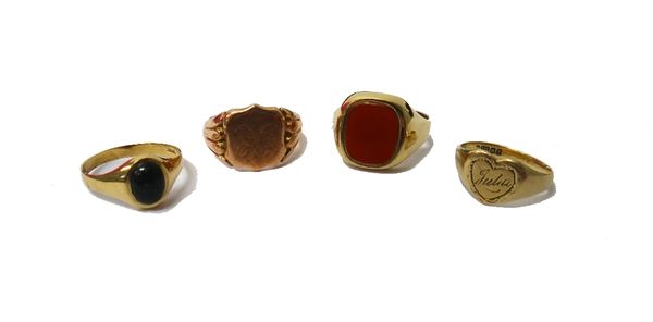 A 9ct rose gold shield shaped signet ring, Chester 1901, a 9ct gold and cornelian set signet ring, a 9ct gold heart shaped signet ring and a 9ct gold