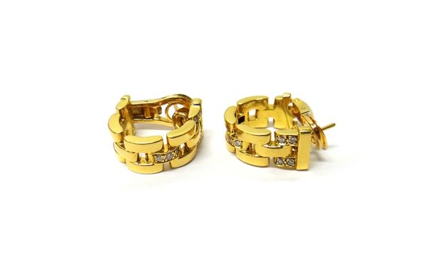 A pair of Cartier gold and diamond set ear clips, each in a curved three row bar link design mounted with rows of circular cut diamonds, detailed Cart