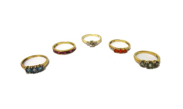 A 9ct gold and ruby set half hoop ring and four further 9ct gold and coloured gemstone set rings.