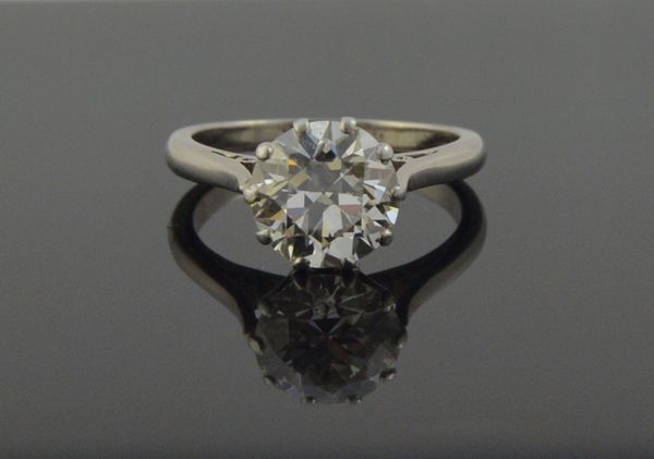 A white gold and platinum, diamond set single stone ring, claw set with a circular cut diamond, the diamond weighs approximately 2.30 cts, ring size L