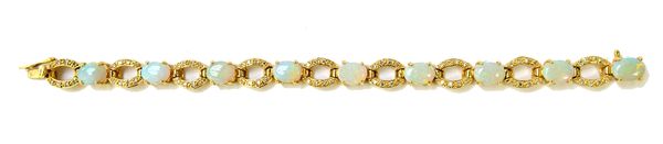 An 18ct gold, opal and diamond set bracelet, claw set with a row of nine oval opals and with diamond set oval openwork links at intervals, on a snap c