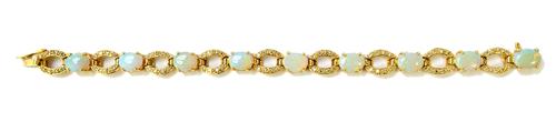 An 18ct gold, opal and diamond set bracelet, claw set with a row of nine oval opals and with diamond set oval openwork links at intervals, on a snap c