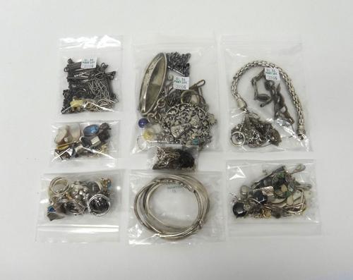 Silver and other jewellery, comprising; twenty rings, eighteen pairs of earrings and drops, a dress Albertine, a garnet set bracelet, four further bra