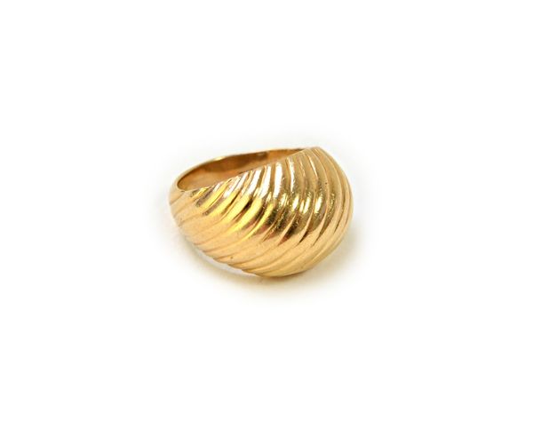 A Tiffany & Co gold ring, in a bombe design, having fluted decoration, ring size K, weight 6.4 gms.  Illustrated