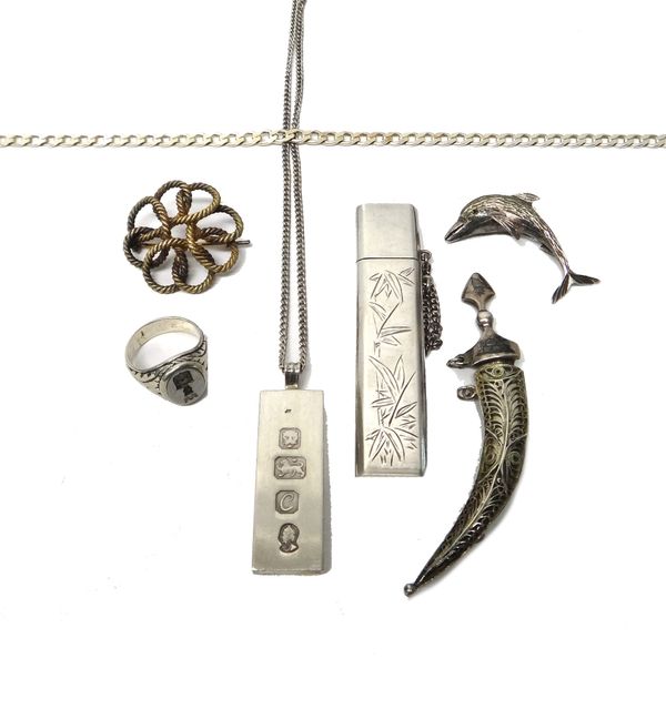 Seven items of mostly silver jewellery, including; a brooch in an entwined wirework design, a brooch designed as a dolphin, a brooch designed as an Ar