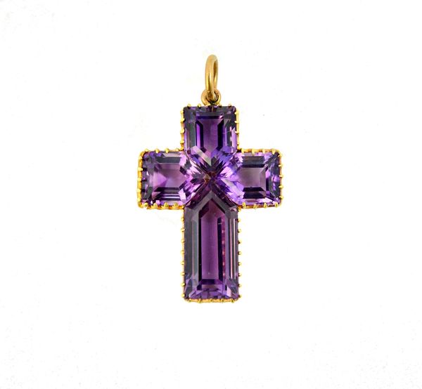 A gold and amethyst set pendant cross, mounted with four faceted amethysts, with the original fitted case, detailed Lambert Jewellers, Coventry St, Lo