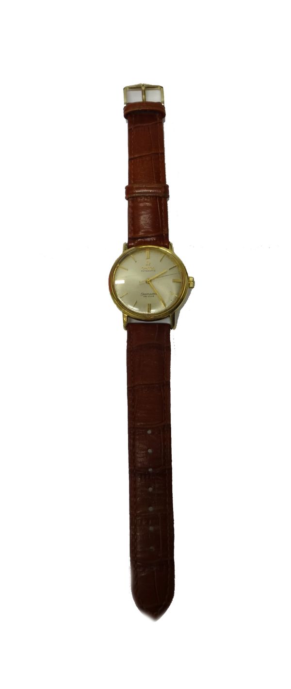 A gentleman's gold cased Omega Seamaster De Ville Automatic wristwatch, the signed circular silvered dial with gilt baton shaped numerals and with cen