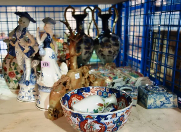 A quantity of ceramics, including Oriental vases, a pair of blue and gilt twin handled vases, a Staffordshire figurine, a soapstone carving and sundry