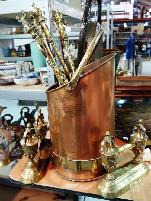 A copper log basket and a quantity of brass fire tools. (qty)