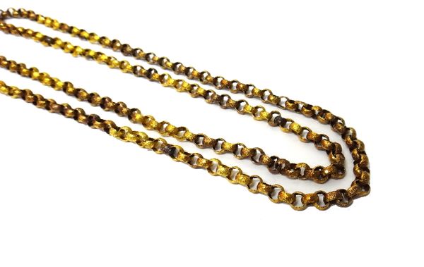 A gold circular link long chain, the circular links decorated with stars, on a beaded ground, on a gold cylindrical clasp with applied bead and wirewo