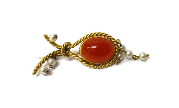 A cornelian and cultured pearl brooch, mounted with an oval cornelian, within a ropetwist surround and with seven cultured pearls at intervals.