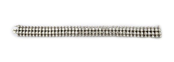 A diamond set bracelet, formed as two rows of forty-three brilliant cut diamonds, between two rows of forty-three smaller brilliant cut diamonds, tota