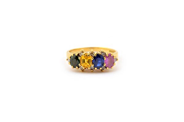 An 18ct gold ring, claw set with a row of four oval cut vary coloured sapphires, comprising; pink, blue, yellow and green and with eight small circula