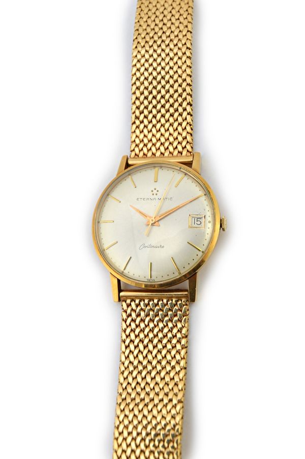 A gentleman's 9ct gold, circular cased Eterna.Matic Centenaire wristwatch, the signed circular silvered dial with gilt baton shaped numerals, centre s