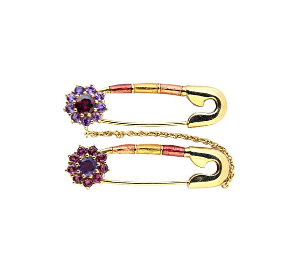 A 9ct gold, amethyst, garnet and vary coloured gemstone set and enamelled twin brooch, designed as two safety pins, each with a gemstone set cluster t