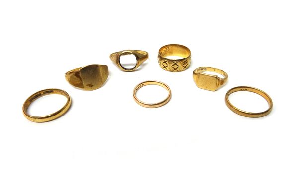 A 9ct gold wide band wedding ring, three 9ct gold plain wedding rings, two 9ct gold signet rings and a 9ct gold signet ring mount (the stone lacking),