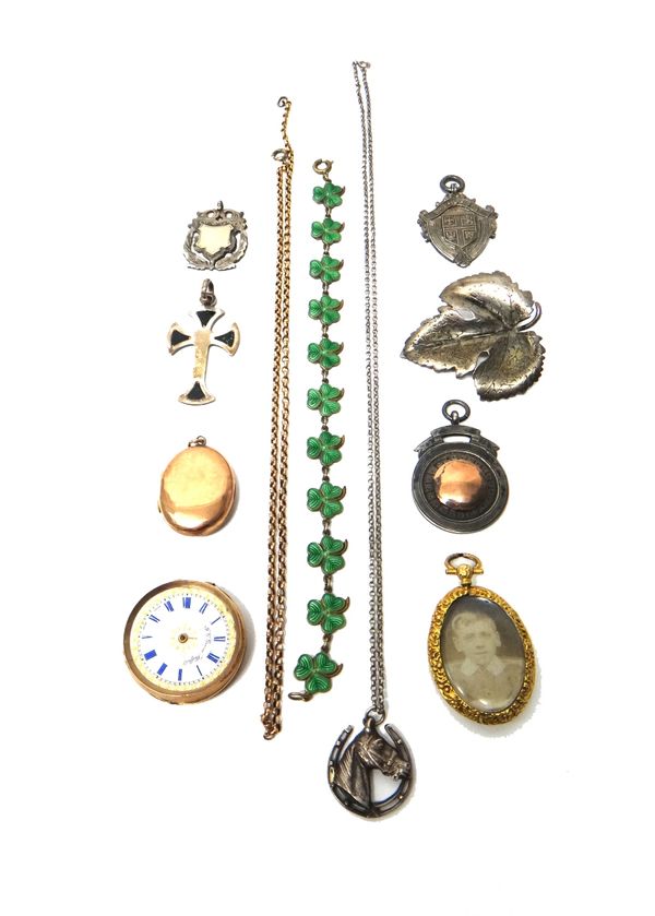 A lady's gold cased, openfaced fob watch (damaged), a gold mounted oval pendant locket, detailed 9 CT, glazed with photographs, a gold back and front