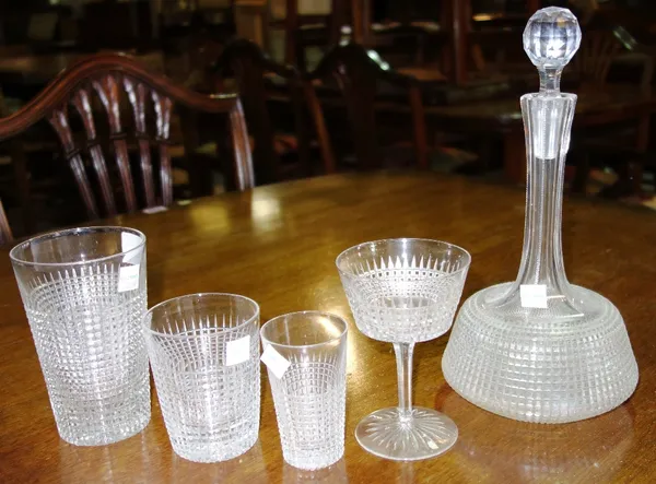 An extensive suite of cut glass table wear including dining glasses, plate, tazzas, decanters and sundry. (qty)